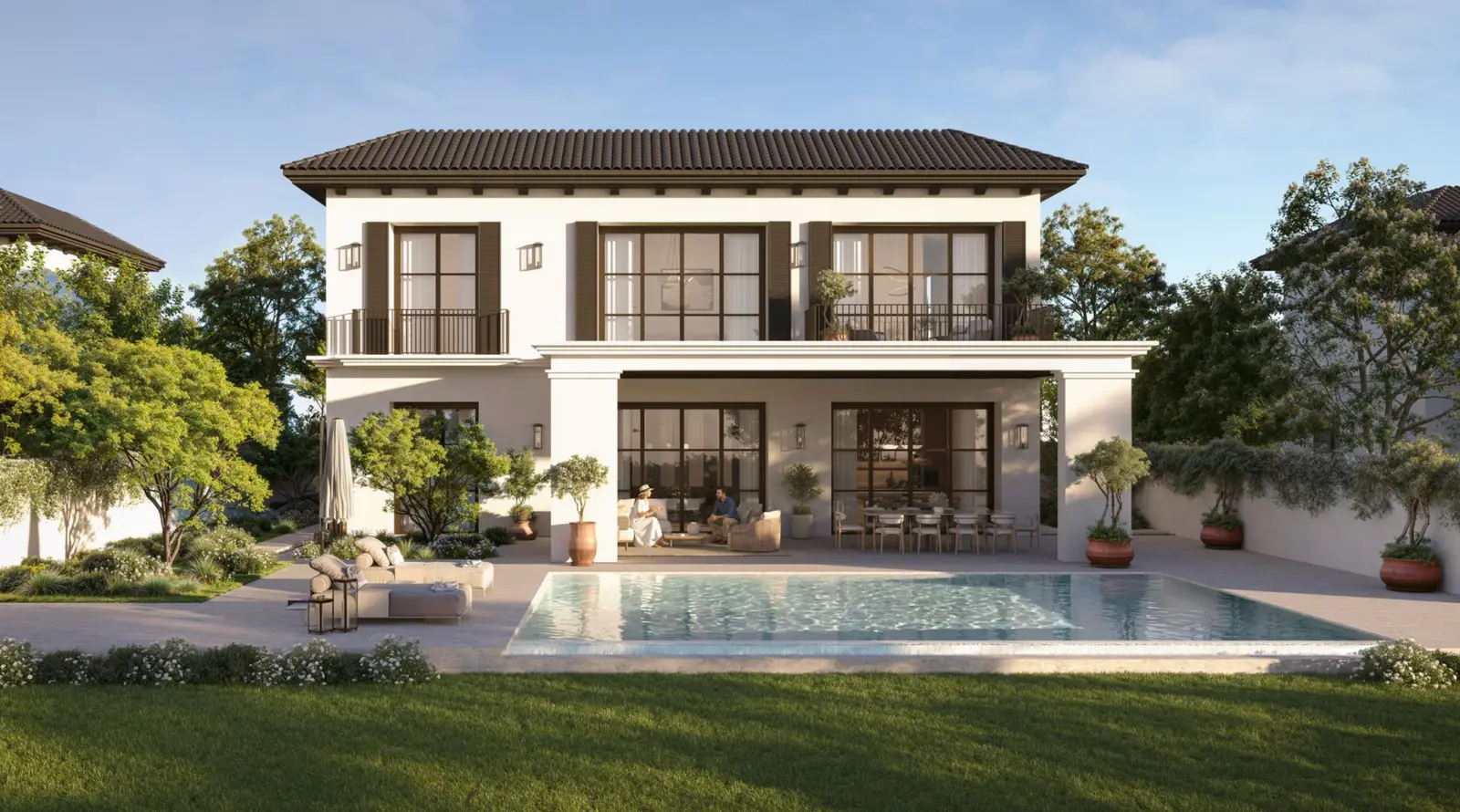 Rear elevation of a Fairway Villa showing the covered terrace, swimming pool and lawn